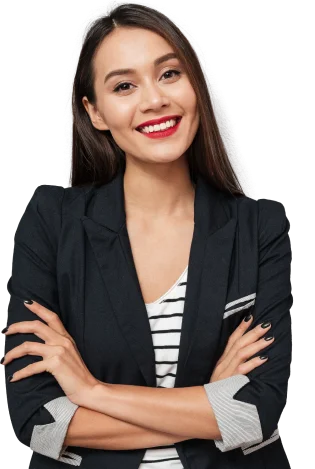 Smiling woman in a black blazer with arms crossed.